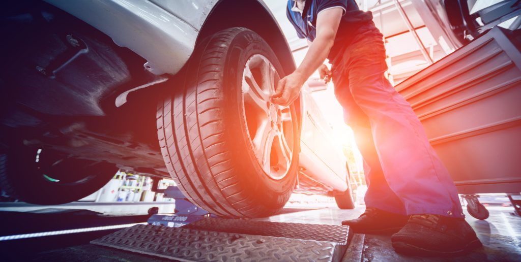 Technician checking a tire